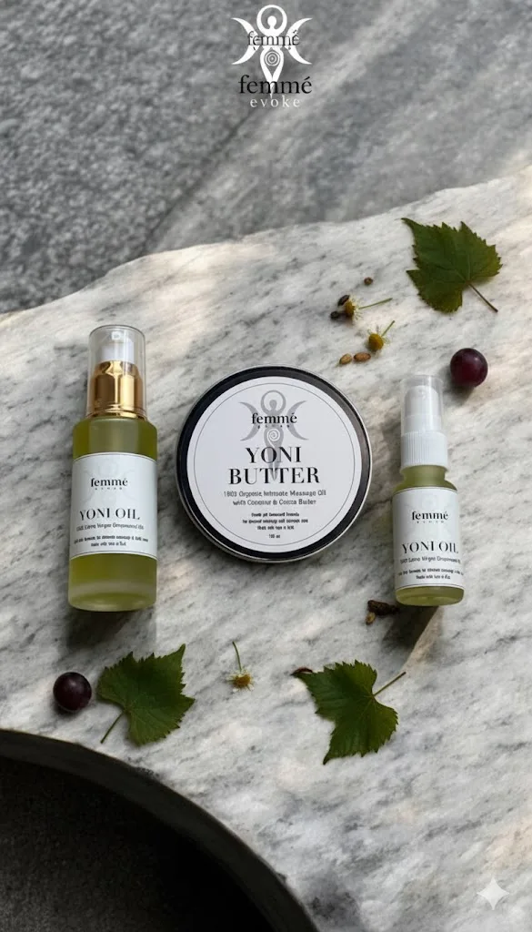 Femme Evoke oils arranged on marble with botanical ingredients